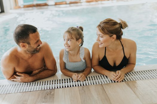 Family in the indoor swimming pool